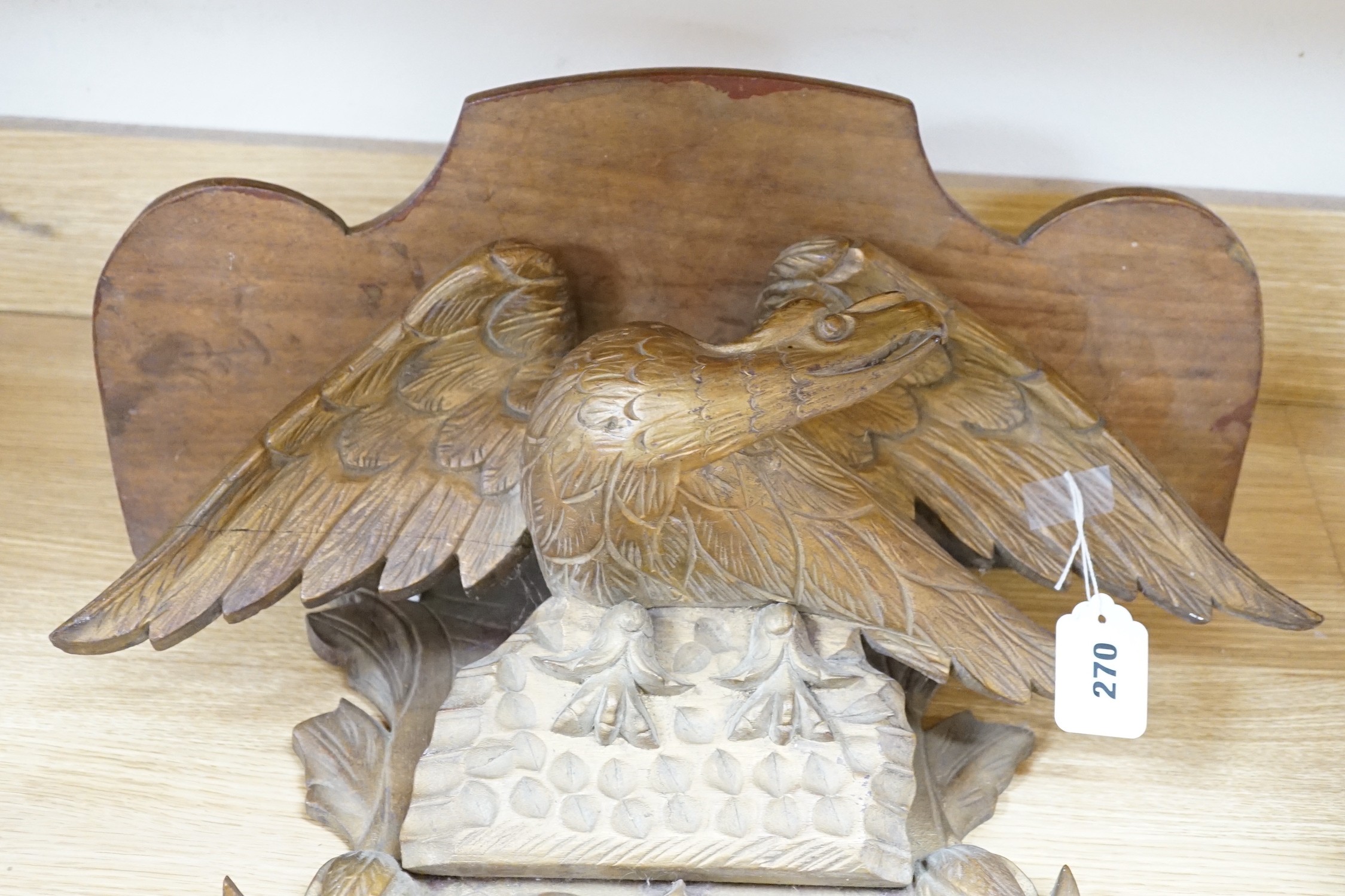 A carved gilt wood ‘eagle’ wall bracket, 62cm long